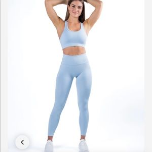 New in package Alphalete Ice Blue set. Halo leggings and Revival Bra size medium
